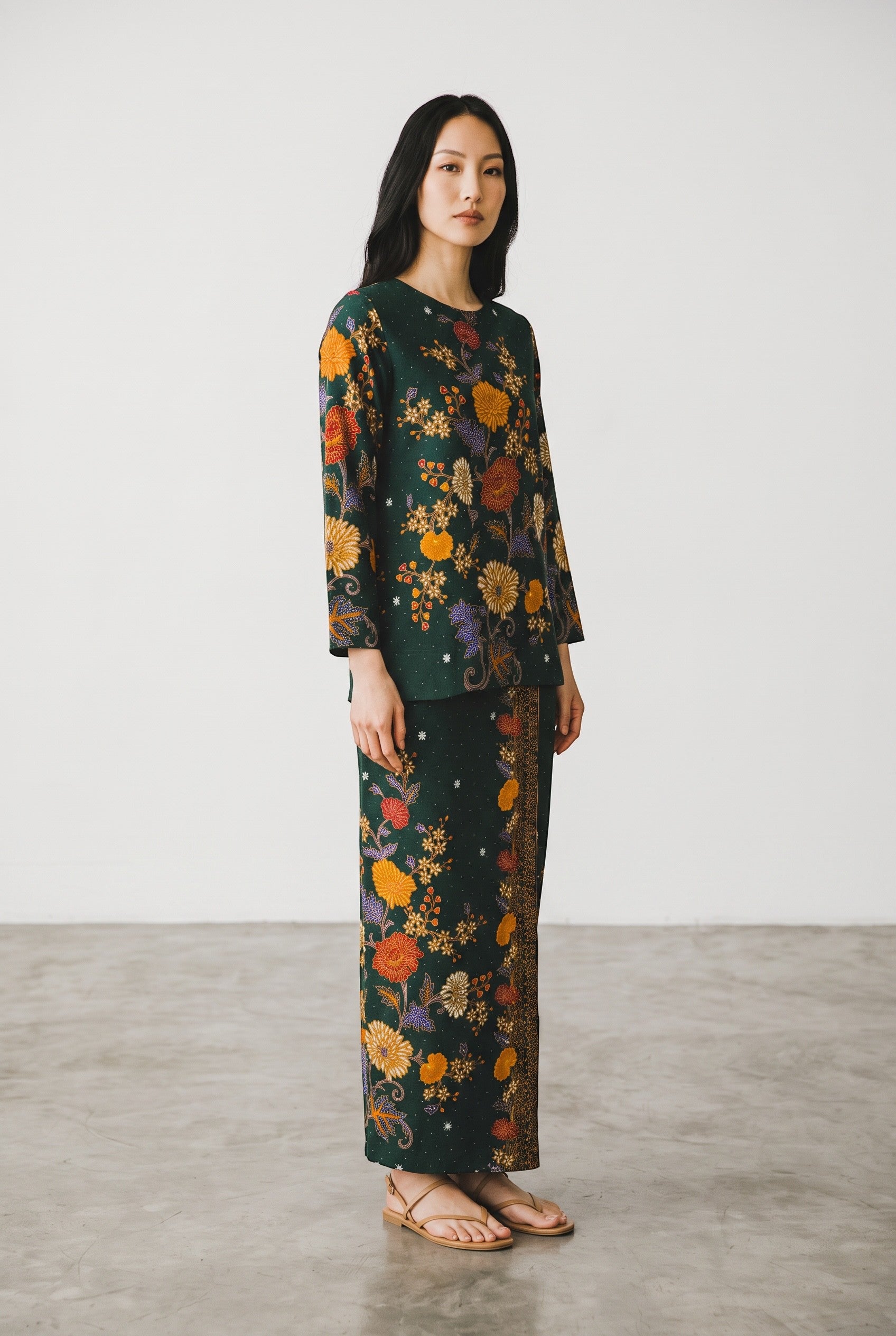 PARCA Nayra in Green set featuring a long-sleeved floral print cotton top and matching maxi sarung skirt