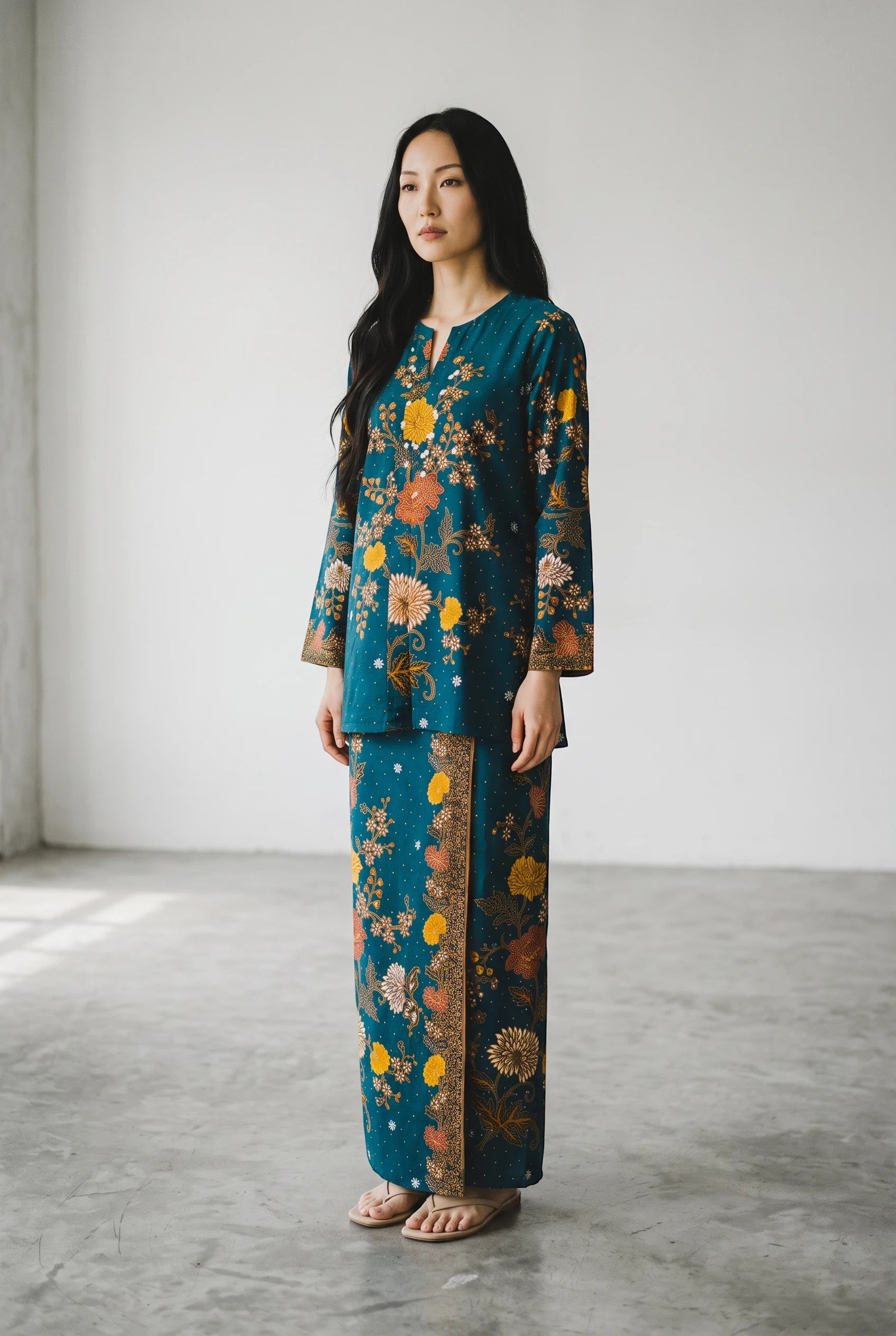 PARCA Nayra turquoise cotton set with floral batik print, featuring a long-sleeve top and matching maxi sarung skirt.